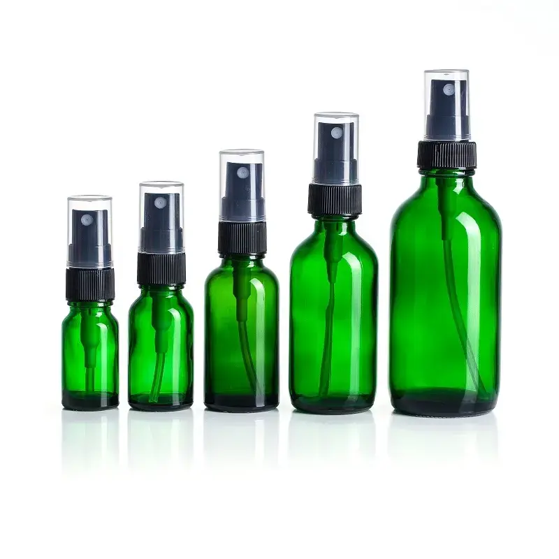 Green essential oil spray glass bottle