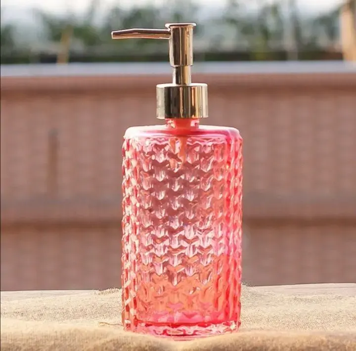 Wave-shaped glass hand sanitizer bottle